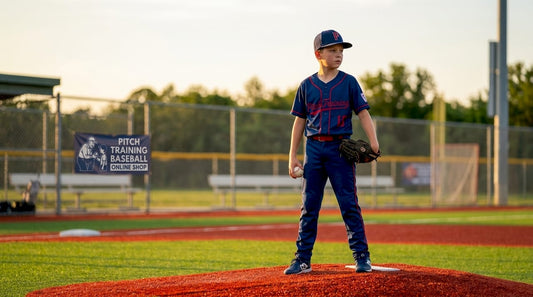 Youth baseball pitcher focusing before throw