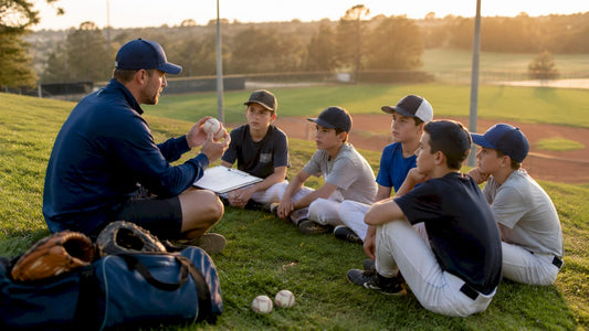 Coach teaching pitching to youth baseball players outdoors