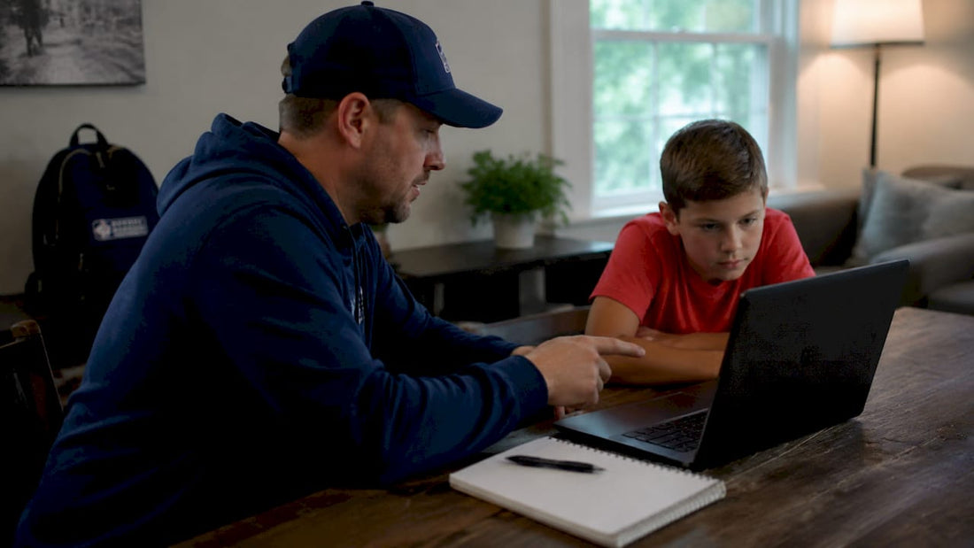 Youth baseball pitcher preparing pitch at mound