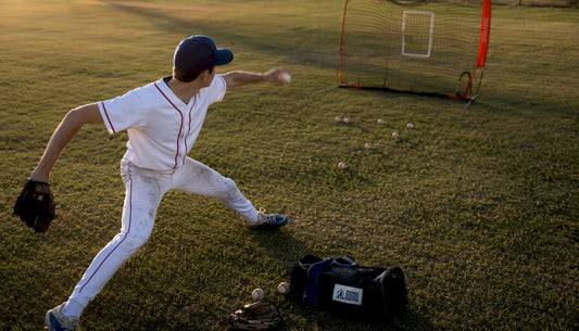 Teen pitcher practicing pitch command drill outdoors