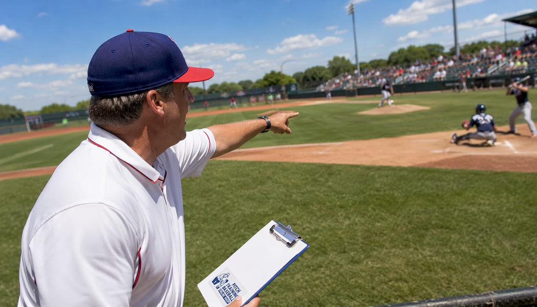 Baseball coach directing pitcher during game