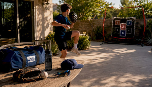 Teen pitching practice with target net outdoors