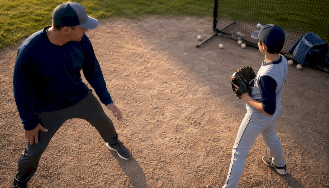 Youth pitcher practicing stance with coach outdoors