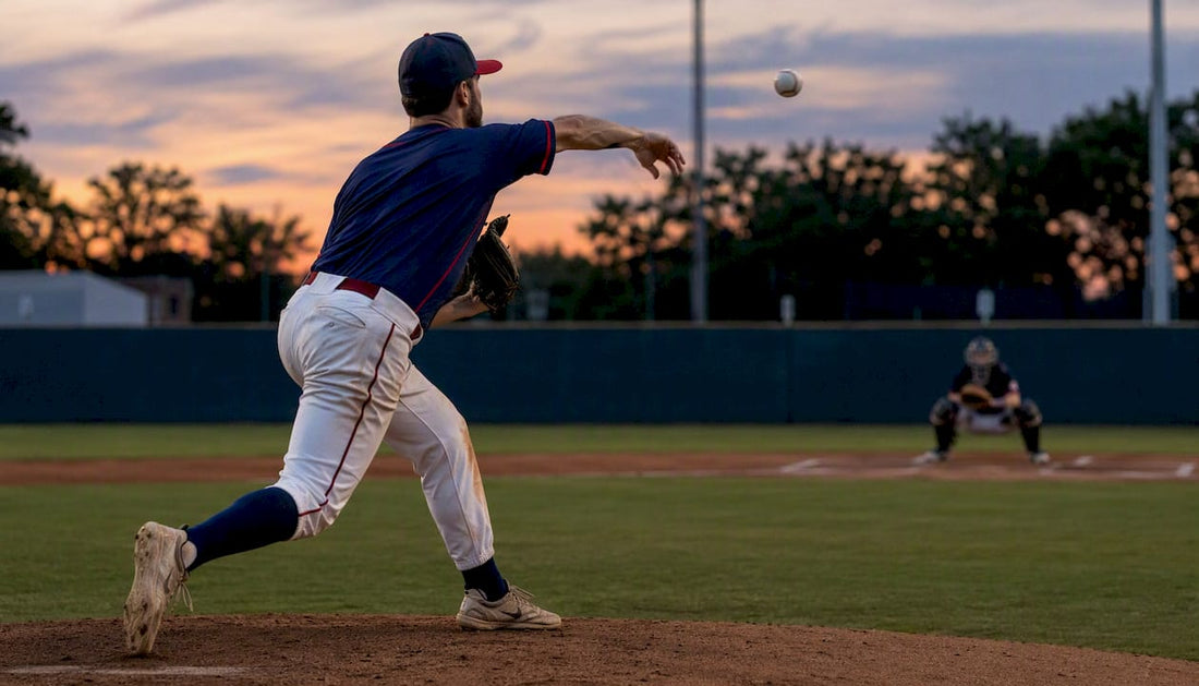 Baseball pitcher delivering slider pitch outdoors