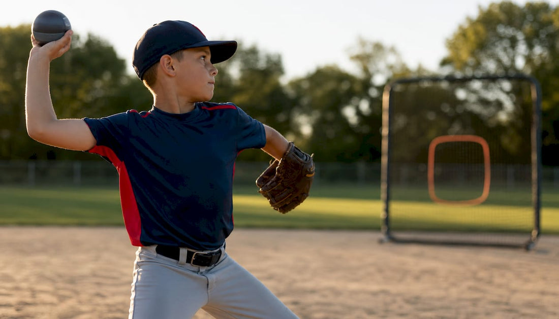 Youth baseball player throwing weighted baseball