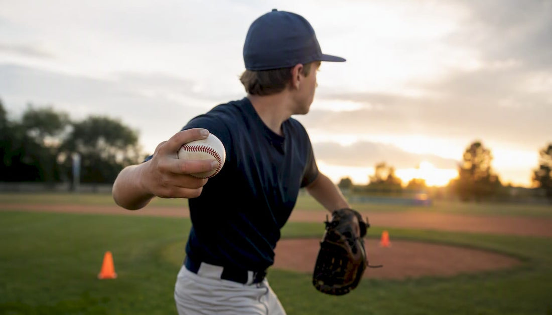 Youth pitcher gripping baseball for curveball