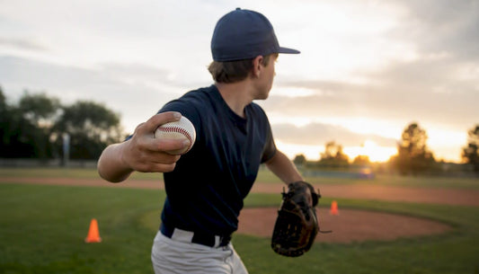Youth pitcher gripping baseball for curveball