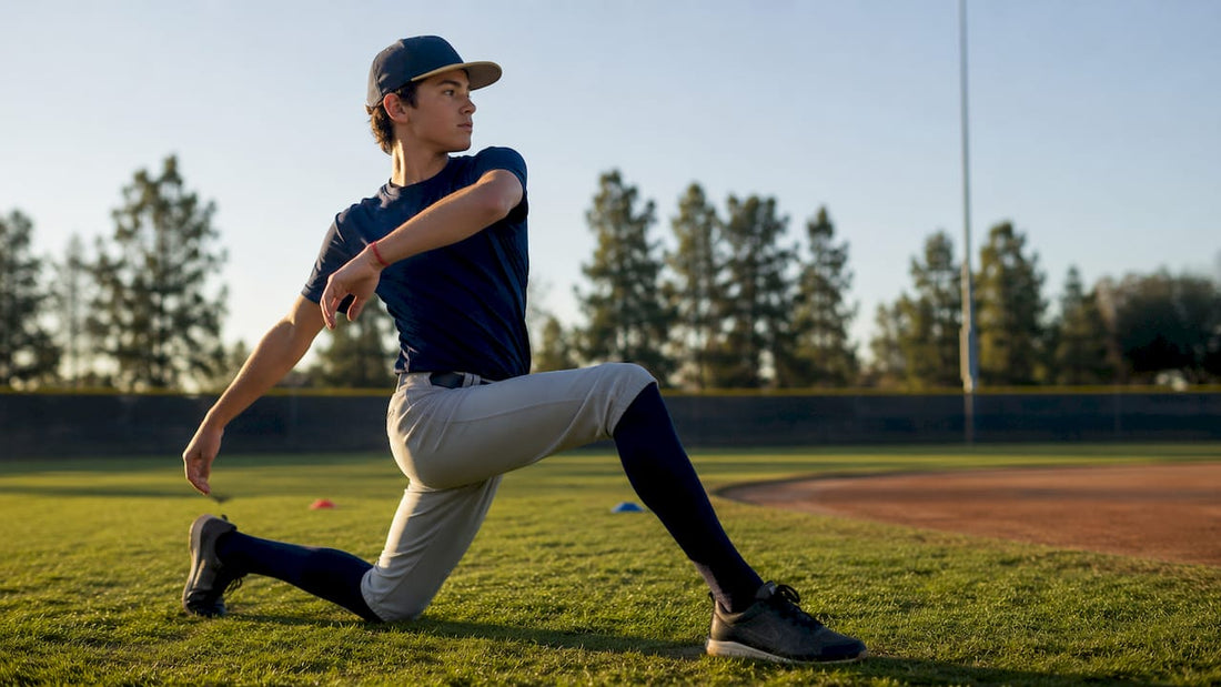 Youth pitcher performing dynamic warmup