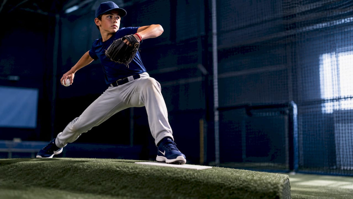Youth pitcher using a portable pitching mound