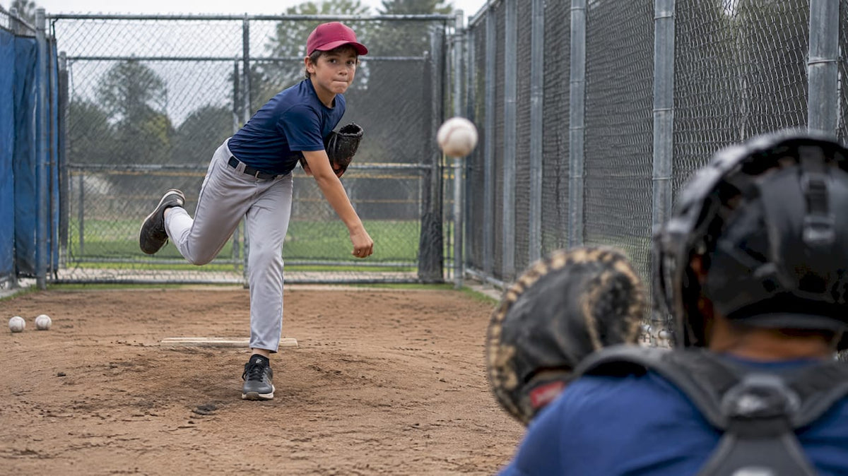Youth pitcher throwing a fastball in bullpen