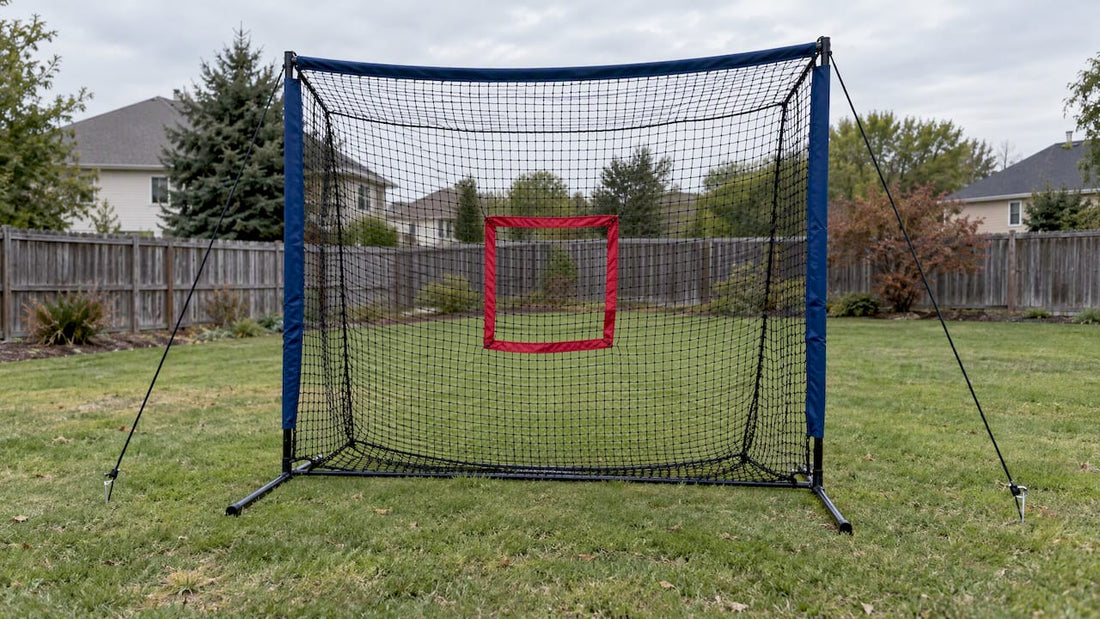 Portable pitching net staked on a lawn