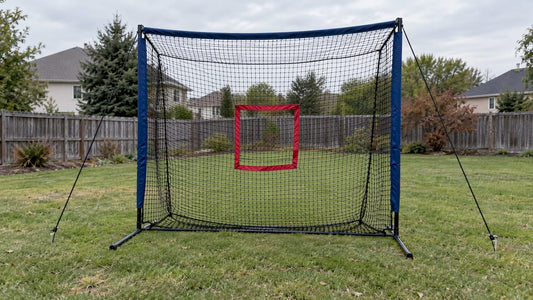 Portable pitching net staked on a lawn