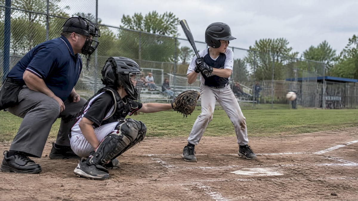 Umpire watching a pitch cross home plate